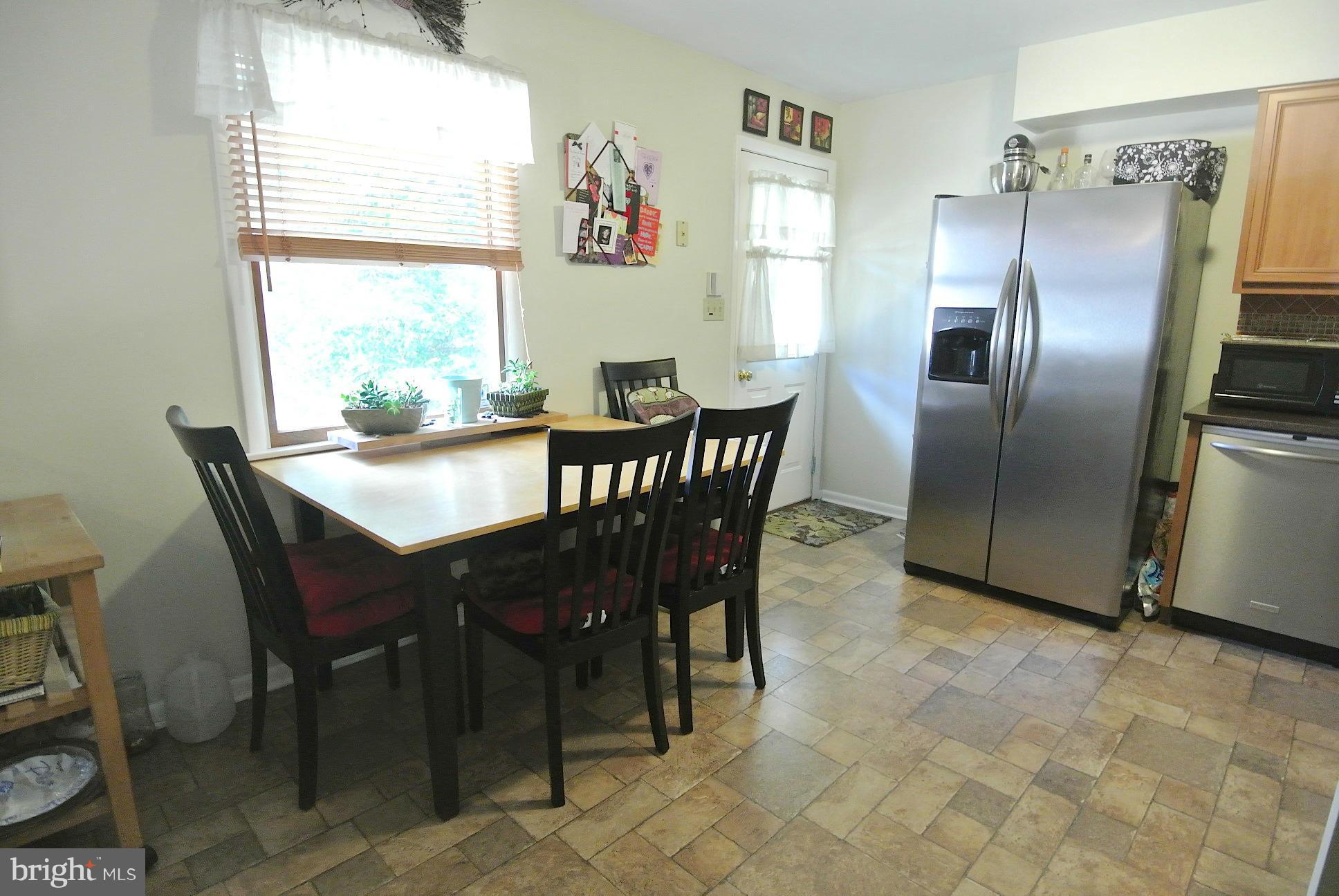 849 Seneca Park Road Baltimore, MD 21220 - Photo 10 of 29 Great Table Space w/Side Entrance to Lvl Backyard