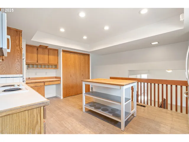 a view of a kitchen with furniture and a window