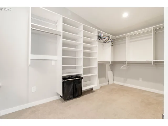 a view of an empty room with a fireplace