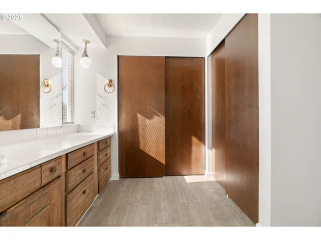 a bathroom with a double vanity sink and mirror