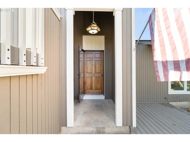 a view of entryway with wooden floor