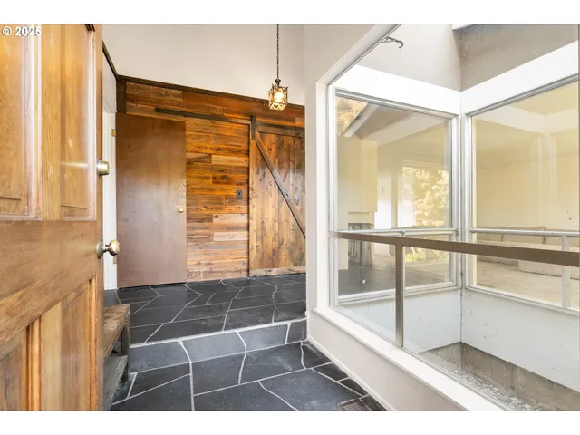 a bathroom with a glass shower door