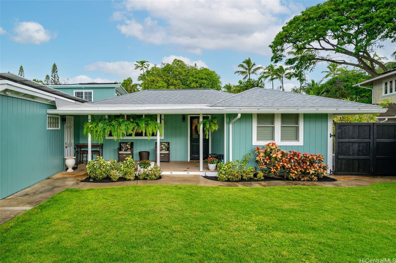 a front view of a house with garden