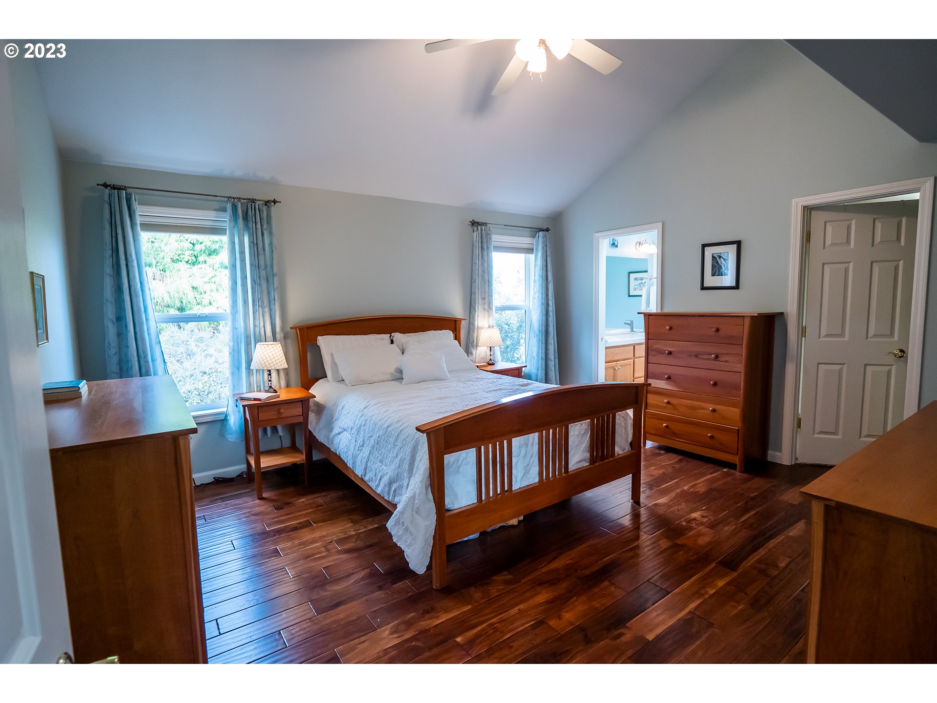 3386 Bentley Avenue Eugene, OR 97405 - Photo 12 of 32 a bedroom with a bed and wooden floor
