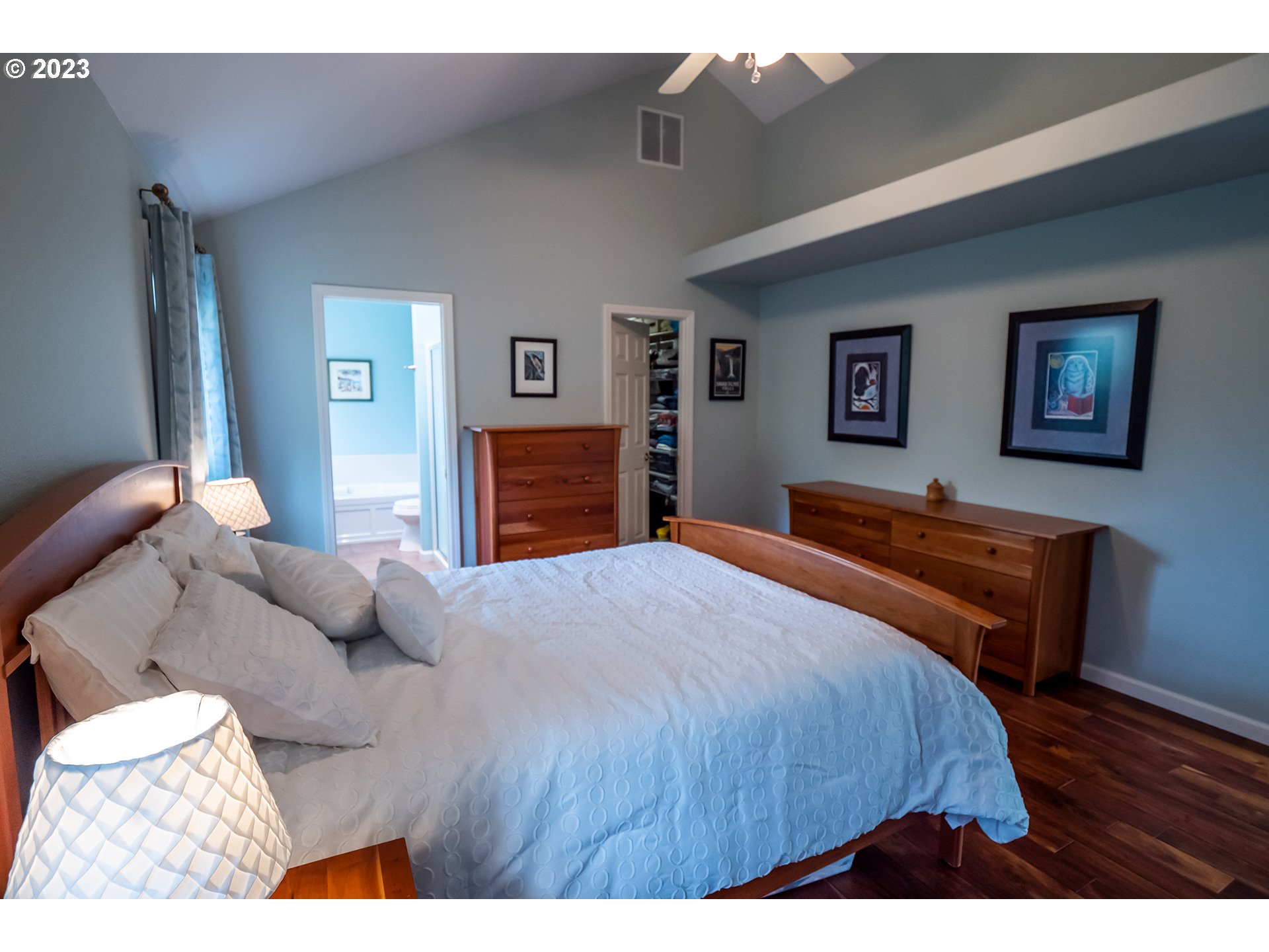 3386 Bentley Avenue Eugene, OR 97405 - Photo 13 of 32 a bedroom with a bed and wooden floor