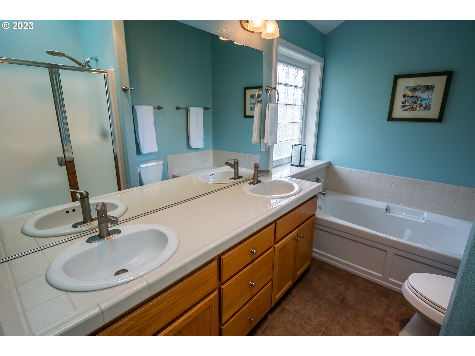 3386 Bentley Avenue Eugene, OR 97405 - Photo 14 of 32 a bathroom with a sink and a mirror