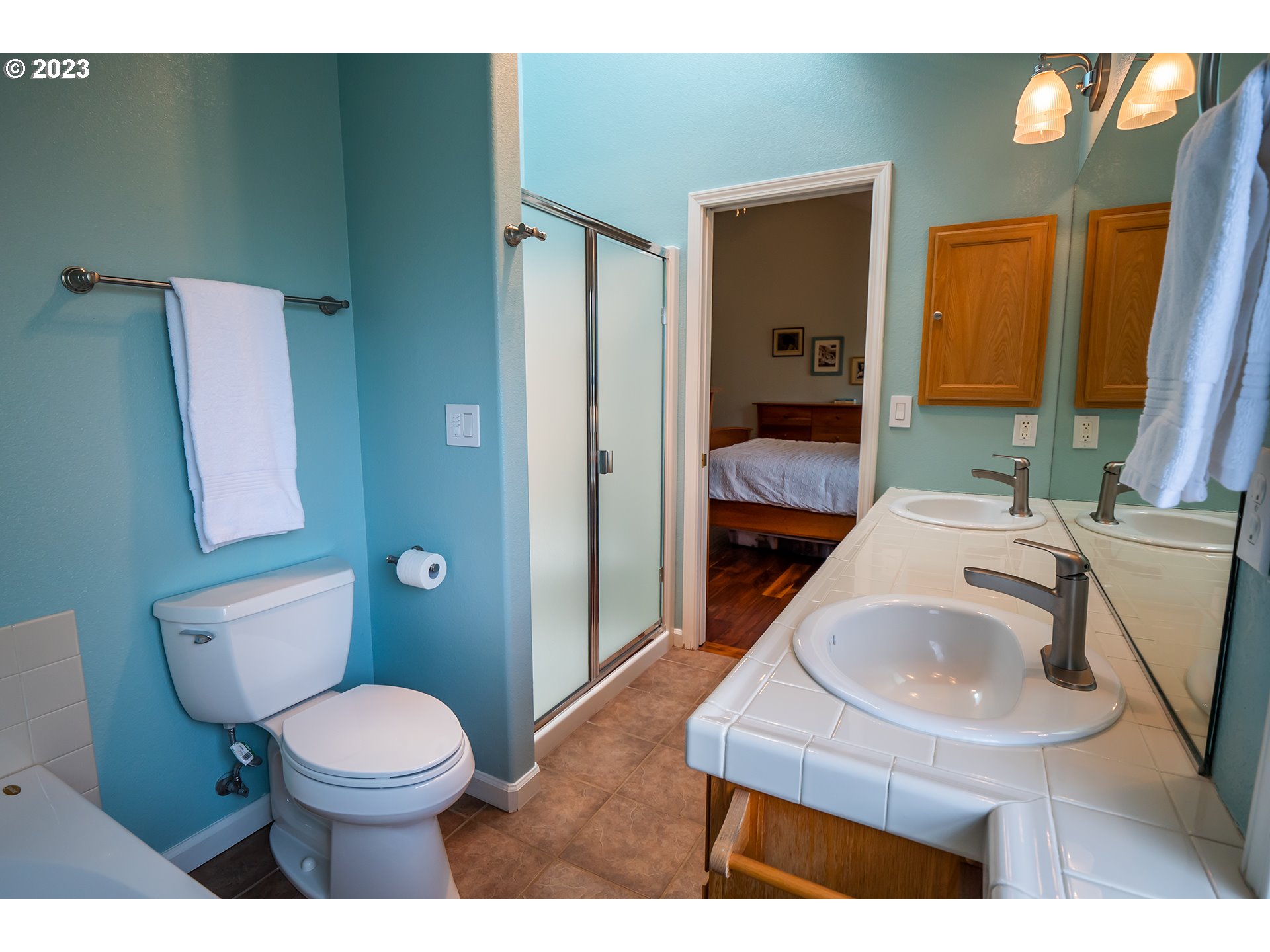 3386 Bentley Avenue Eugene, OR 97405 - Photo 15 of 32 a bathroom with a sink toilet and shower