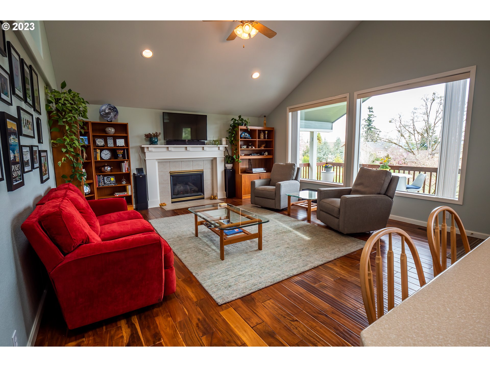 3386 Bentley Avenue Eugene, OR 97405 - Photo 5 of 32 a living room with furniture fireplace and flat screen tv