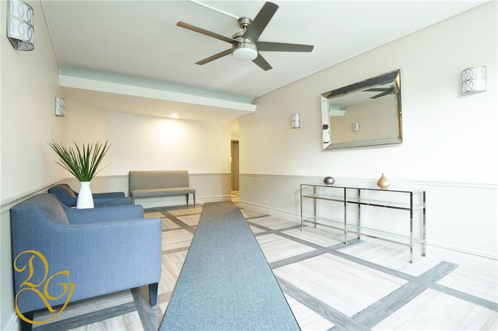 7520 Ridge Boulevard, Unit 1A Brooklyn, NY 11209 - Photo 13 of 18 a living room with furniture and wooden floor