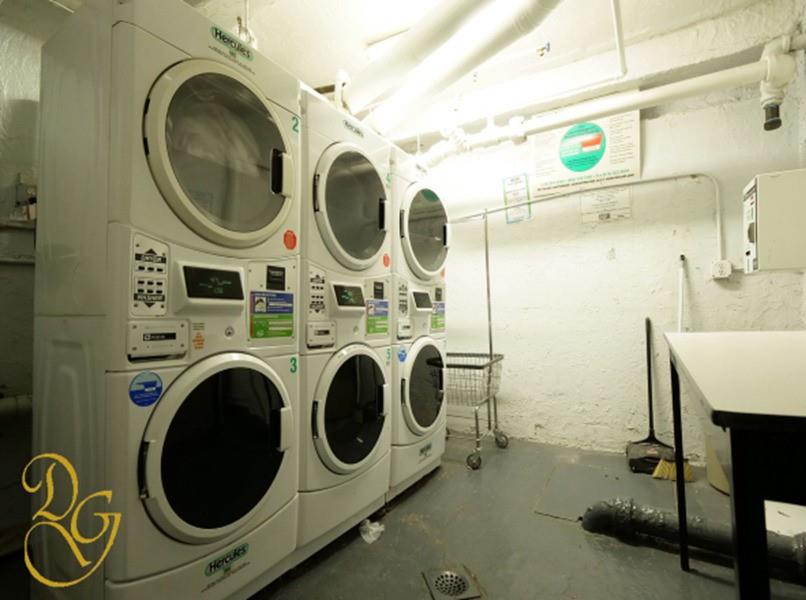 7520 Ridge Boulevard, Unit 1A Brooklyn, NY 11209 - Photo 15 of 18 a utility room with dryer and washer