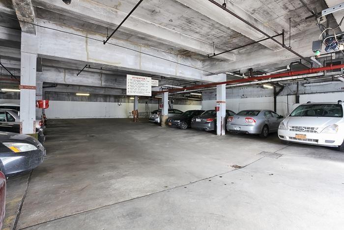 7520 Ridge Boulevard, Unit 1A Brooklyn, NY 11209 - Photo 16 of 18 a view of parking garage with cars