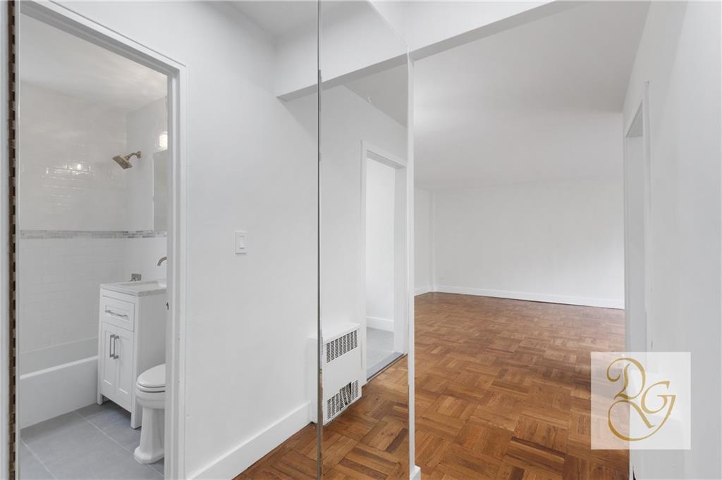 7520 Ridge Boulevard, Unit 1A Brooklyn, NY 11209 - Photo 7 of 18 a bathroom with a toilet and a shower