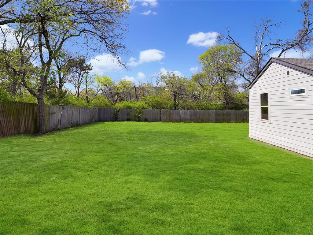 5544 Ranchero Lane Dallas, TX 75236 - Photo 16 of 21 a view of a backyard with large trees