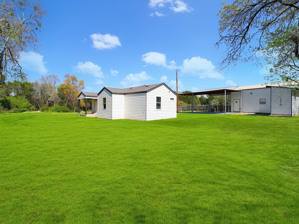 5544 Ranchero Lane Dallas, TX 75236 - Photo 17 of 21 a view of a house with a yard