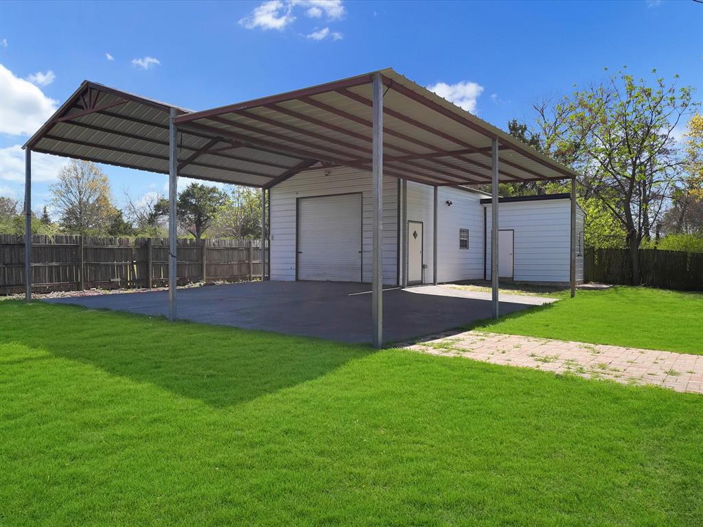 5544 Ranchero Lane Dallas, TX 75236 - Photo 18 of 21 a view of a backyard with a garden
