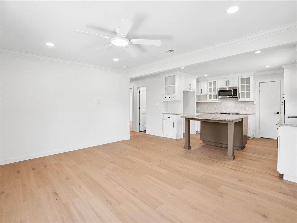 5544 Ranchero Lane Dallas, TX 75236 - Photo 4 of 21 a view of kitchen with cabinets and wooden floor