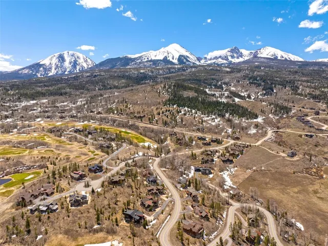 a view of a city with mountains in the background