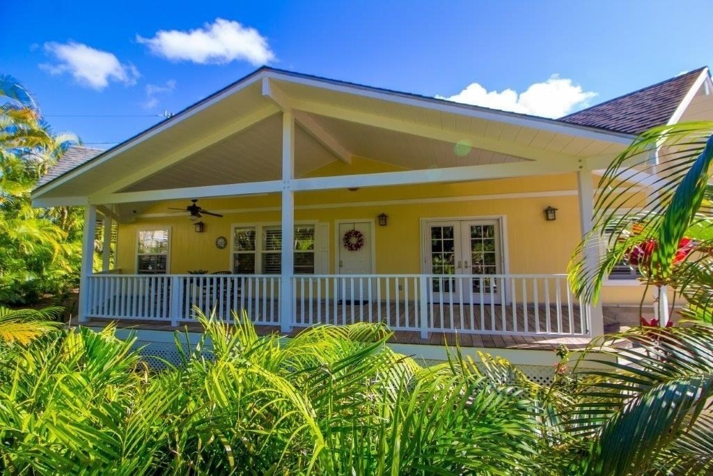 6671 Puupilo Road Kapaa, HI 96746 - Photo 1 of 24 a front view of a house with a garden