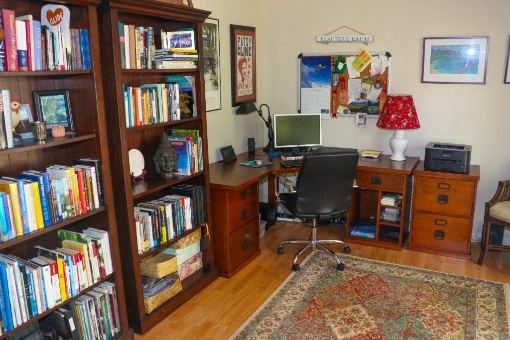 6671 Puupilo Road Kapaa, HI 96746 - Photo 20 of 24 a workspace with furniture and book shelf