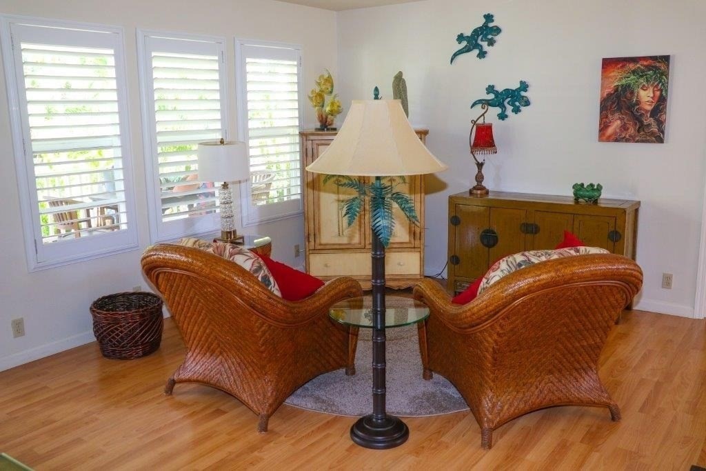 6671 Puupilo Road Kapaa, HI 96746 - Photo 9 of 24 a living room with furniture a couch and a floor to ceiling window