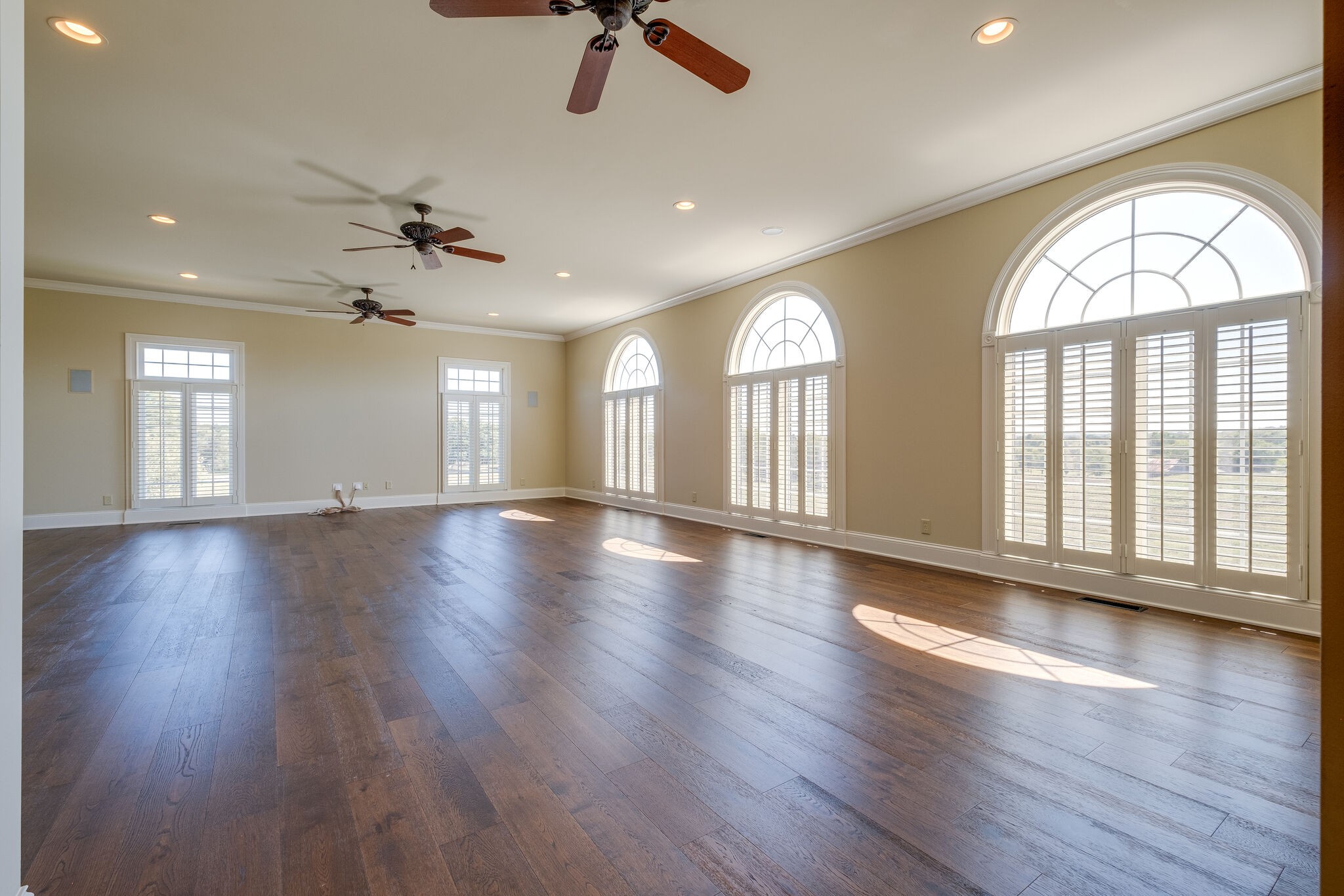 1800 Horn Springs Road Lebanon, TN 37087 - Photo 20 of 56 an empty room with wooden floor and windows with curtains