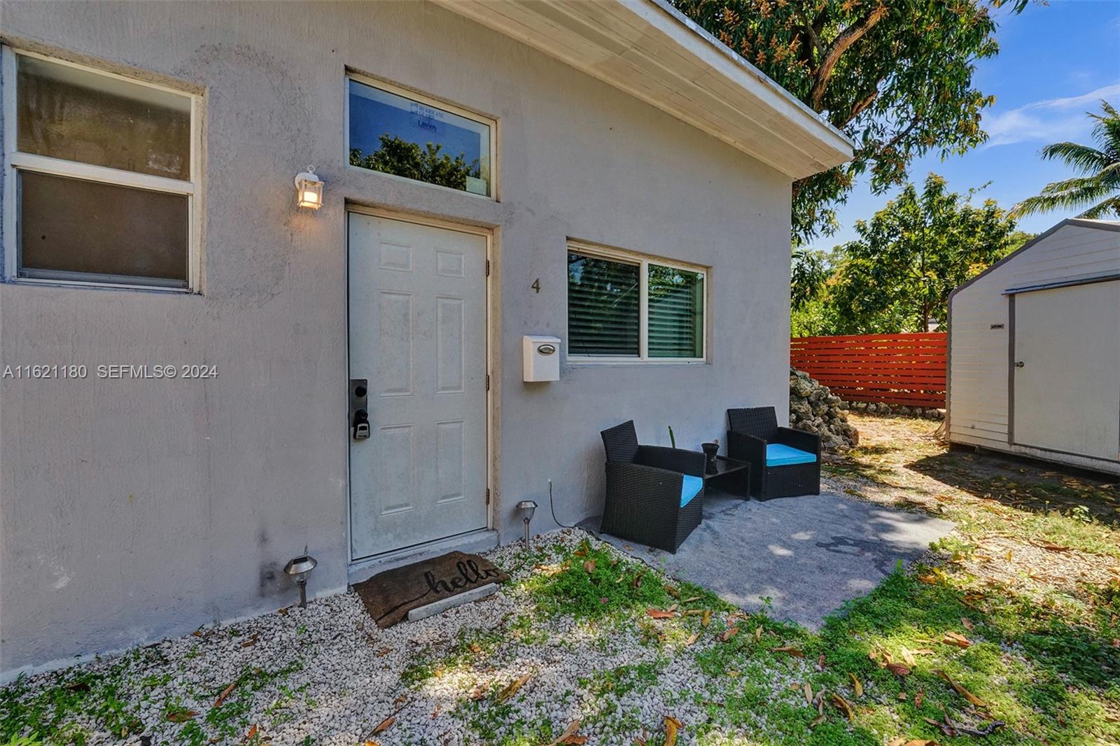 418 Northwest 47th Street Miami, FL 33127 - Photo 14 of 24 a backyard of a house with outdoor seating