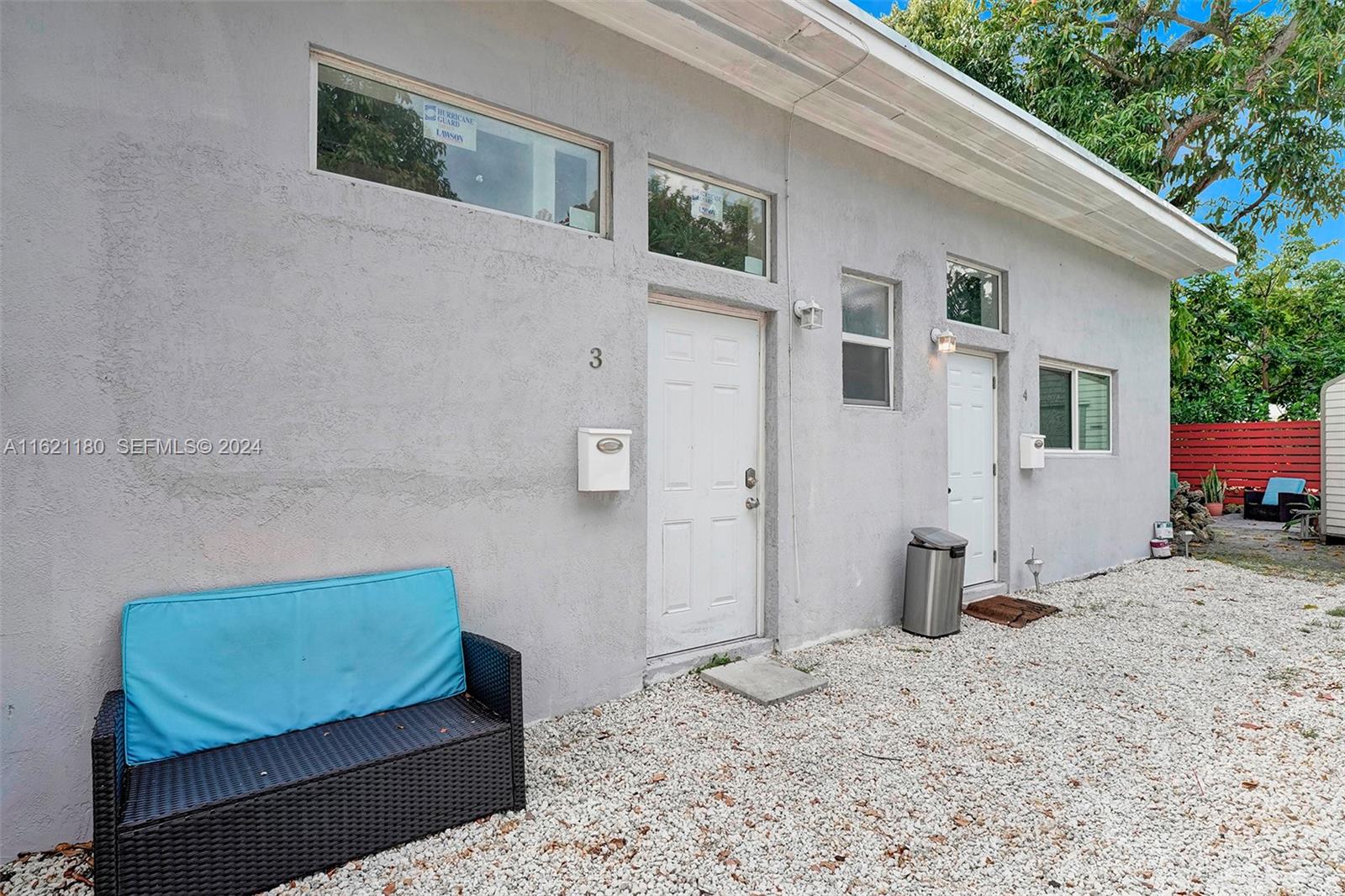 418 Northwest 47th Street Miami, FL 33127 - Photo 24 of 24 a view of a bedroom with a bed and wooden floor