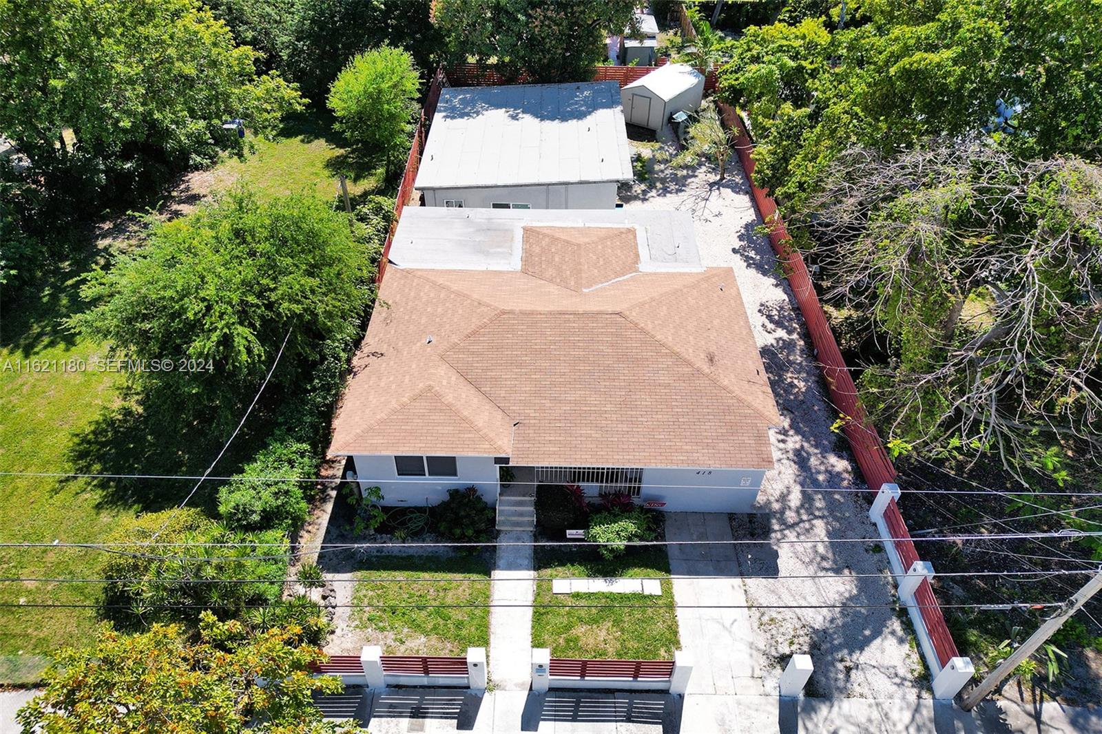 418 Northwest 47th Street Miami, FL 33127 - Photo 3 of 24 an aerial view of a house with swimming pool and garden view