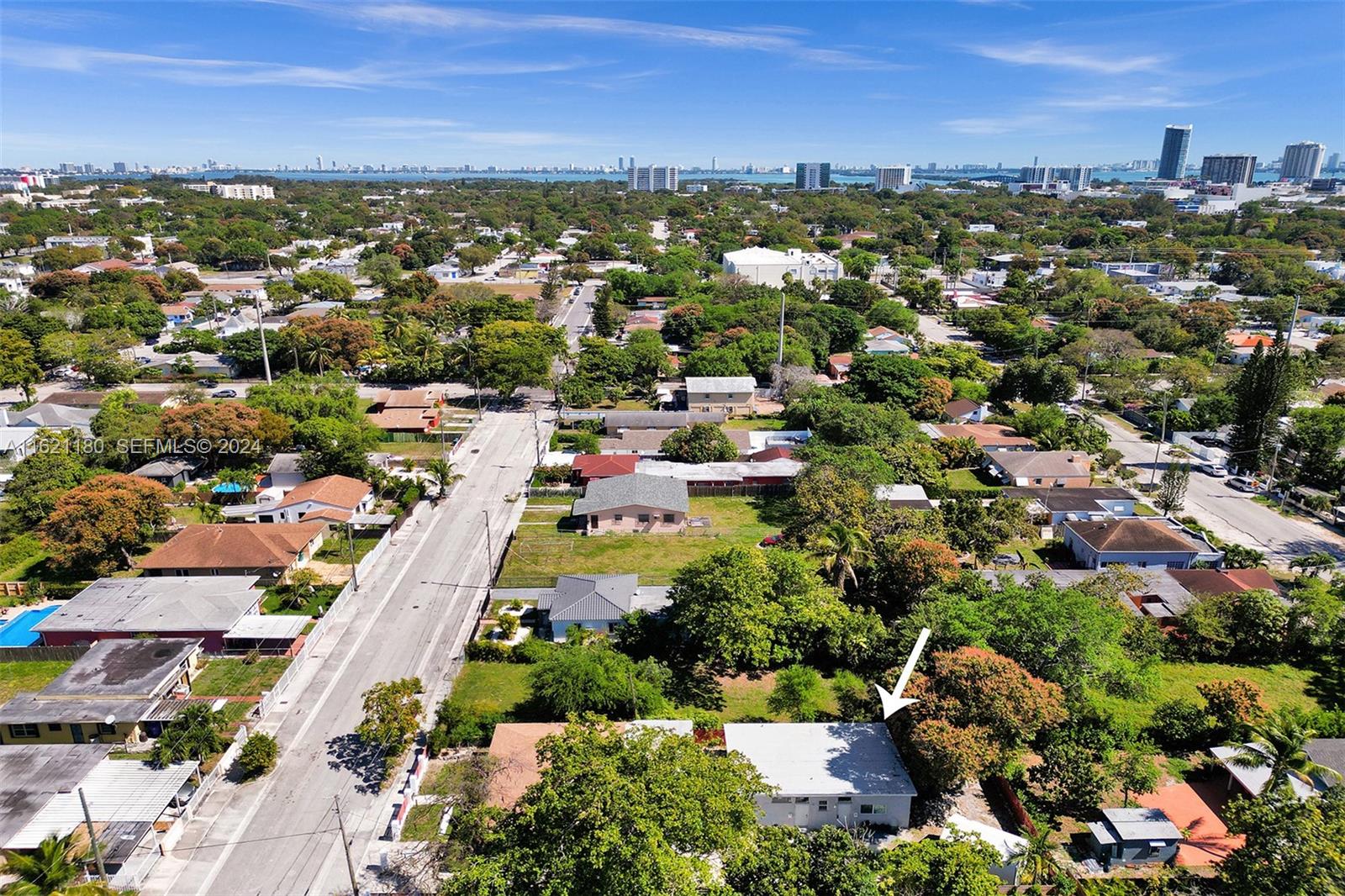 418 Northwest 47th Street Miami, FL 33127 - Photo 5 of 24 an aerial view of residential houses with outdoor space and trees