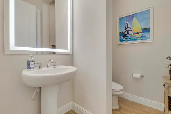a large spacious bathroom with a double vanity sink a mirror and a bathtub