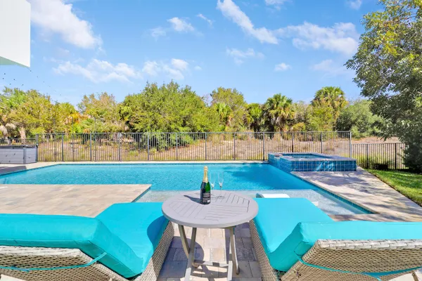 a living room with furniture and a piano