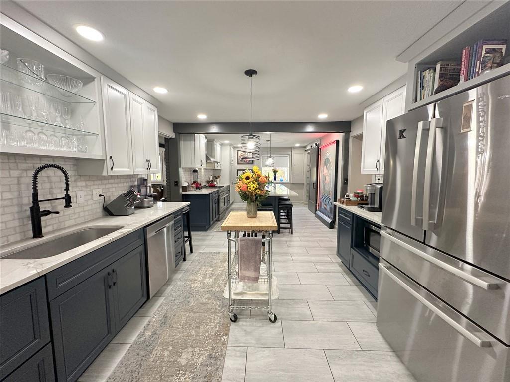 257 Stoup Road Mars, PA 16046 - Photo 13 of 50 a kitchen with a refrigerator and a sink