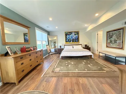 a living room with furniture pool table and a flat screen tv