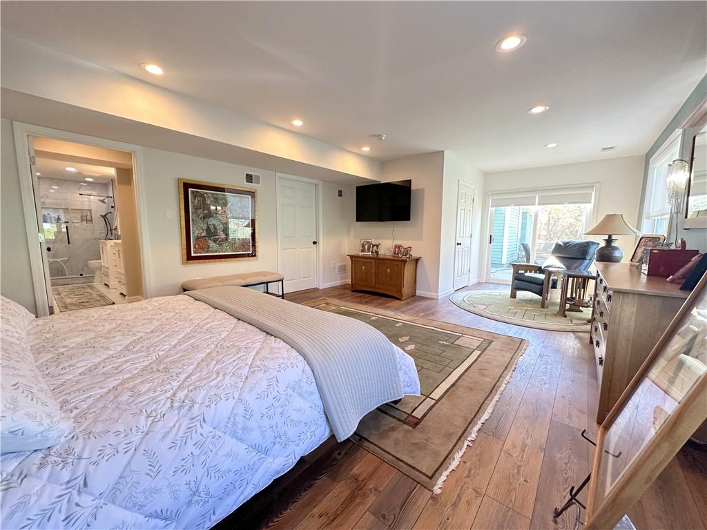 257 Stoup Road Mars, PA 16046 - Photo 24 of 50 a spacious bedroom with a bed a couch and a large window