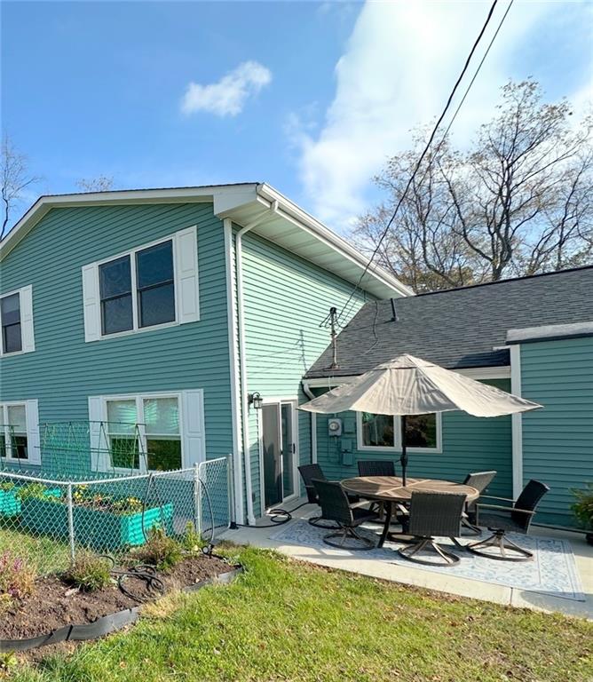 257 Stoup Road Mars, PA 16046 - Photo 25 of 50 a backyard of a house with table and chairs