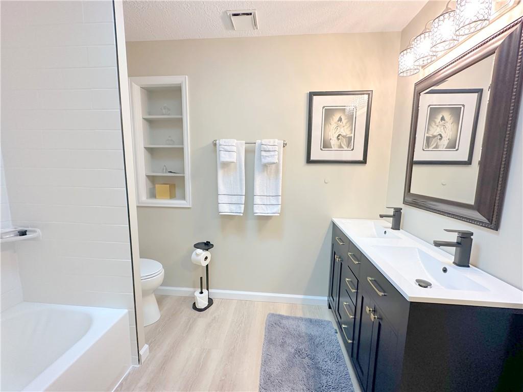 257 Stoup Road Mars, PA 16046 - Photo 37 of 50 a bathroom with a tub sink and mirror