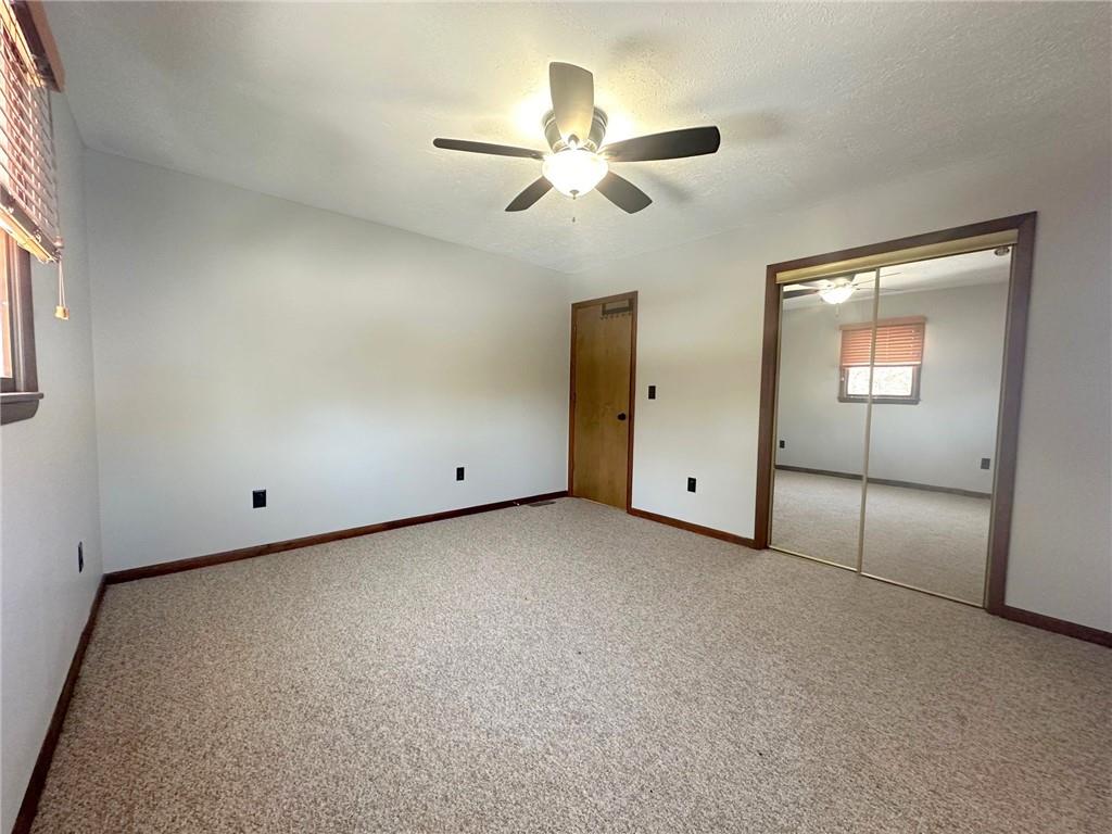 257 Stoup Road Mars, PA 16046 - Photo 41 of 50 an empty room with a ceiling fan and a window