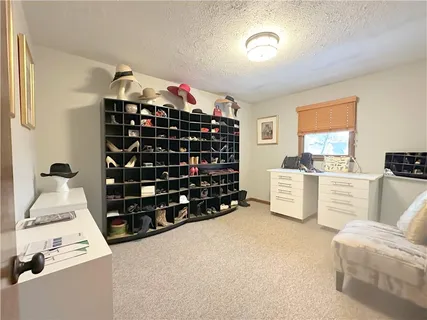 a room with furniture a chandelier and a window