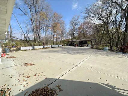 a view of a parking space with white house