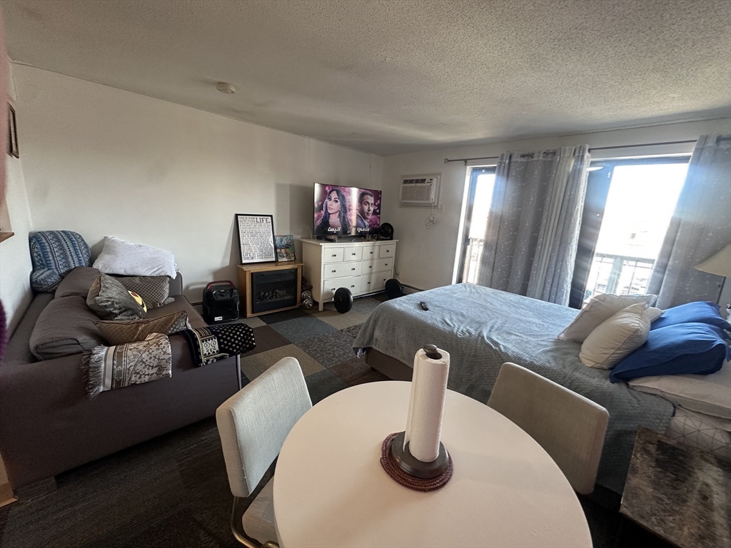 175 Ward Street, Unit 78 Revere, MA 02151 - Photo 13 of 20 a living room with furniture and a flat screen tv