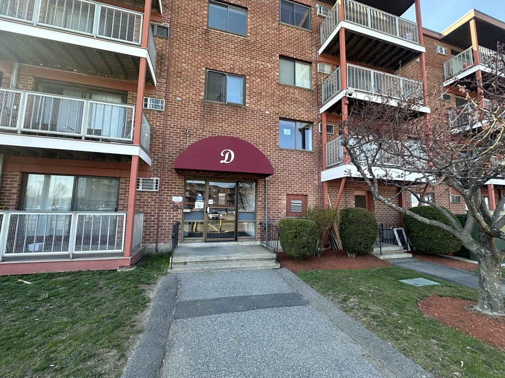 175 Ward Street, Unit 78 Revere, MA 02151 - Photo 2 of 20 a front view of a house with a yard