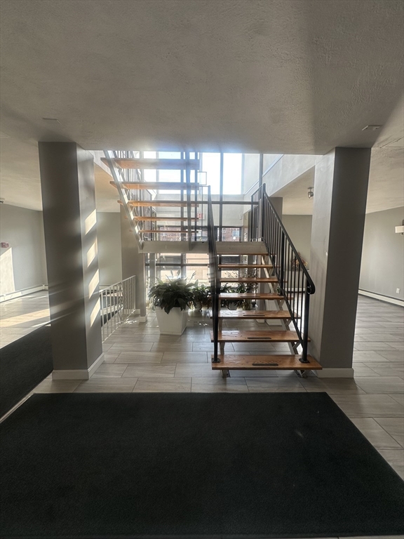 175 Ward Street, Unit 78 Revere, MA 02151 - Photo 4 of 20 a view of entryway and hall with wooden floor
