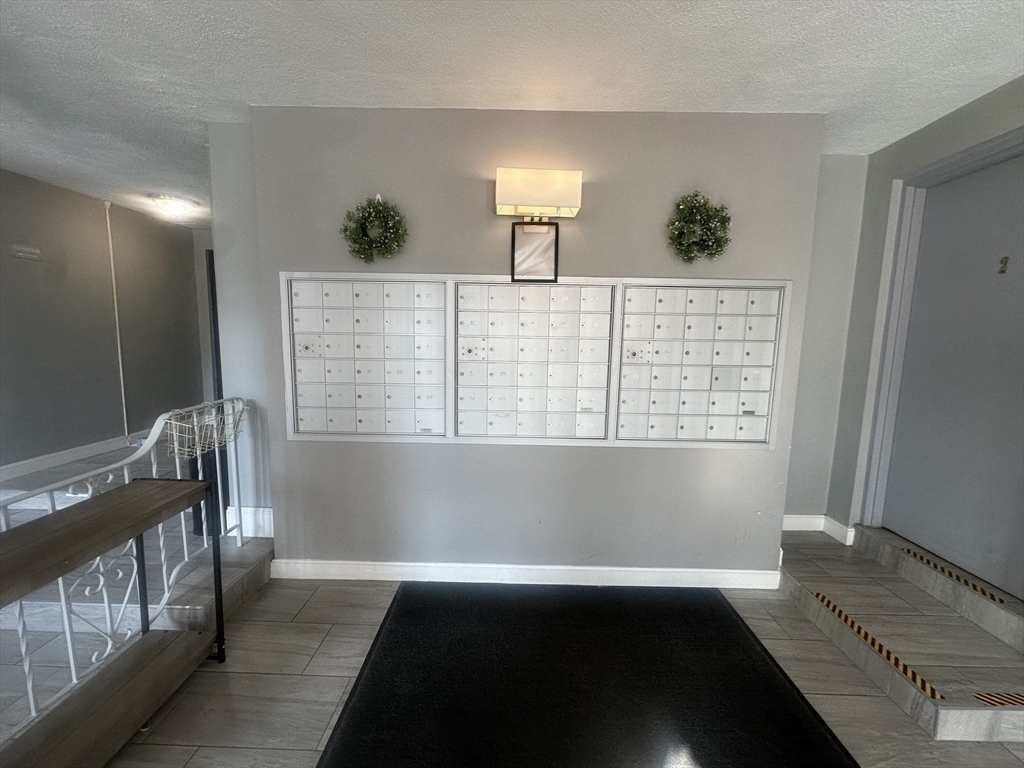 175 Ward Street, Unit 78 Revere, MA 02151 - Photo 5 of 20 a view of an empty room and wooden floor
