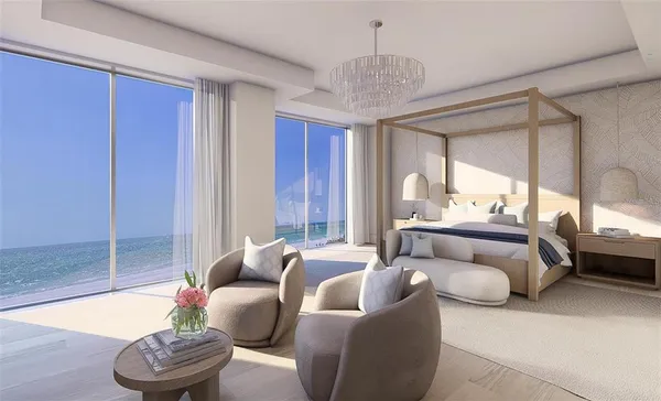a bedroom with furniture and a large window