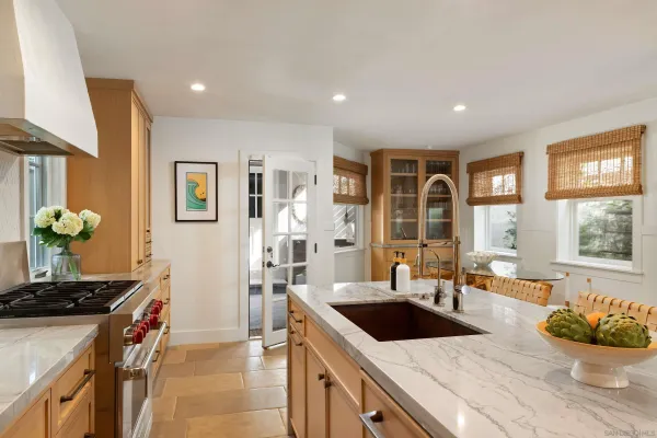 a kitchen with a sink stove and refrigerator