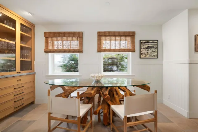 a view of a dining room with furniture and windows
