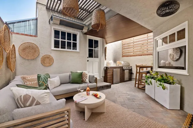 a living room with fireplace furniture and a window