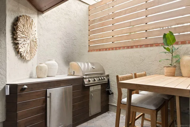 a kitchen with a table chairs and a stove