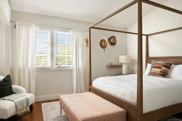 a bedroom with a bed and a couch