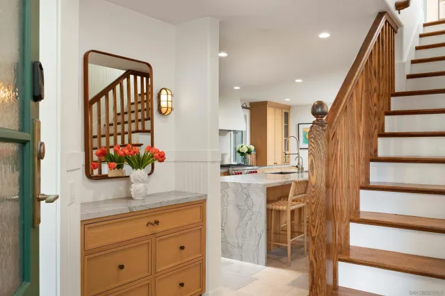 a view of kitchen with wooden floor and cabinets